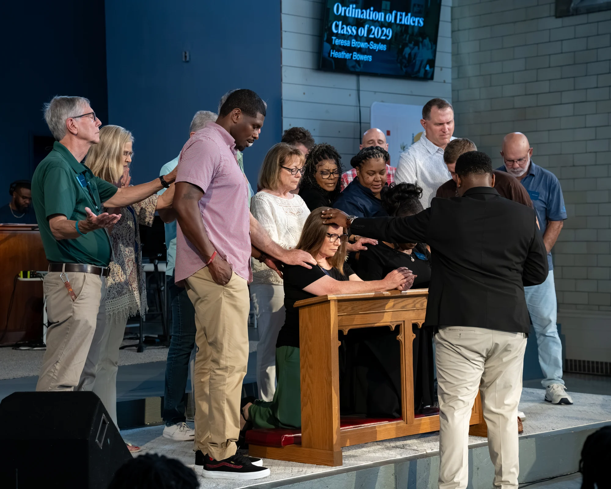 The Bridge City Church community praying together